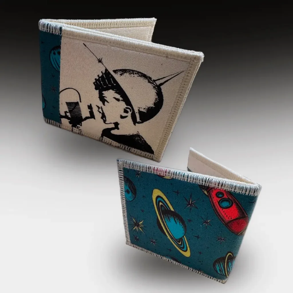 Two wallets with fabrics made by Scotty Jones