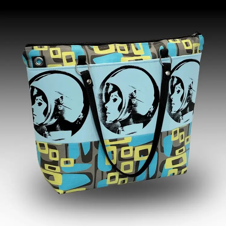 Lady with helmet on a bag made by Scotty Jones