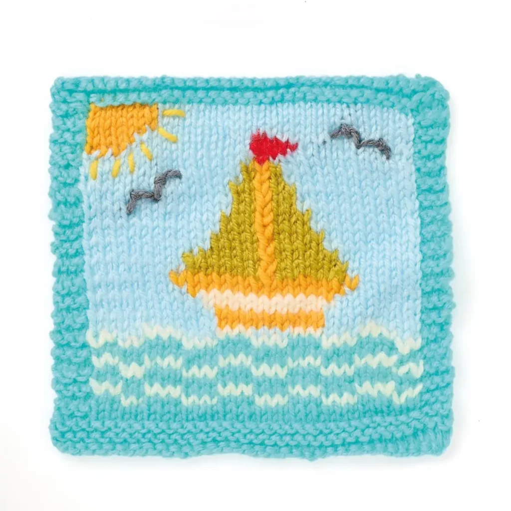 Sailboat and waves knitted sampler by Sian Brown